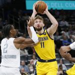 
              Indiana Pacers center Domantas Sabonis (11) takes the ball to the basket against Oklahoma City Thunder guard Shai Gilgeous-Alexander (2) in the first half of an NBA basketball game Friday, Jan. 28, 2022, in Oklahoma City. (AP Photo/Nate Billings)
            