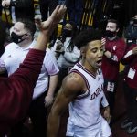 
              Indiana's Rob Phinisee celebrates as he leaves the court following an NCAA college basketball game against Purdue, Thursday, Jan. 20, 2022, in Bloomington, Ind. (AP Photo/Darron Cummings)
            