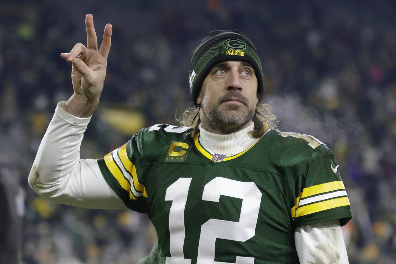 Green Bay Packers' Aaron Rodgers acknowledges the crowd after an NFL football game against the Minn...