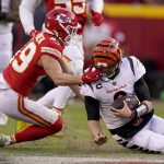 
              Kansas City Chiefs safety Daniel Sorensen (49) defends against a run by Cincinnati Bengals quarterback Joe Burrow, right, during the second half of the AFC championship NFL football game, Sunday, Jan. 30, 2022, in Kansas City, Mo. (AP Photo/Charlie Riedel)
            