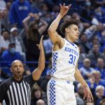
              Kentucky guard Kellan Grady (31) celebrates making three pointer during the first half of an NCAA college basketball game against Mississippi State in Lexington, Ky., Tuesday, Jan. 25, 2022. (AP Photo/Michael Clubb)
            