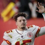 
              Kansas City Chiefs quarterback Patrick Mahomes (15) waves after the Chiefs defeated the Denver Broncos in an NFL football game Saturday, Jan. 8, 2022, in Denver. (AP Photo/David Zalubowski)
            