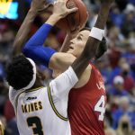 
              Kansas forward Mitch Lightfoot (44) shoots over George Mason guard Davonte Gaines (3) during the first half of an NCAA college basketball game in Lawrence, Kan., Saturday, Jan. 1 2022. (AP Photo/Orlin Wagner)
            