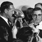 
              FILE - Football commissioner Pete Rozelle, left, presents the trophy to Green Bay Packers coach Vince Lombardi after they beat the Kansas City Chiefs in the Super Bowl in Los Angeles, Jan. 15, 1967. The trophy for the Super Bowl winner has borne Lombardi's name since his death in 1970. (AP Photo, File)
            