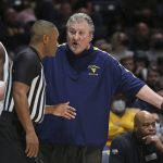 
              West Virginia coach Bob Huggins speaks with an official during the first half of an NCAA college basketball game against Oklahoma in Morgantown, W.Va., Wednesday, Jan. 26, 2022. (AP Photo/Kathleen Batten)
            