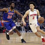 
              Detroit Pistons guard Cade Cunningham (2) drives to the basket against Golden State Warriors forward Andrew Wiggins (22) during the first half of an NBA basketball game in San Francisco, Tuesday, Jan. 18, 2022. (AP Photo/Jed Jacobsohn)
            