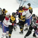 
              Boston Bruins and Montreal Canadiens players engage during the second period of an NHL hockey game, Wednesday, Jan. 12, 2022, in Boston. (AP Photo/Mary Schwalm)
            