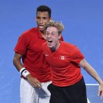 
              Team Canada's Felix Auger-Aliassime, left, and teammate Denis Shapovalov celebrate their win over Team Spain in the ATP Cup final in Sydney, Australia, Sunday, Jan. 9, 2022. (Dean Lewins/AAP Image via AP)
            