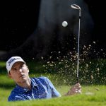 
              Russell Henley hits out of the first bunker during the third round of the Sony Open golf tournament, Saturday, Jan. 15, 2022, at Waialae Country Club in Honolulu. (AP Photo/Matt York)
            