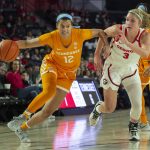 
              Tennessee Lady Vols guard Rae Burrell (12) drives past Georgia Lady Bulldogs guard Sarah Ashlee Barker (3) during the half of an NCAA college basketball game Sunday, Jan. 23, 2022, in Athens, Ga. (AP Photo/Hakim Wright Sr.)
            