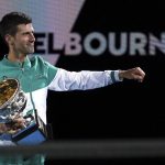 
              FILE - Serbia's Novak Djokovic holds the Norman Brookes Challenge Cup after defeating Russia's Daniil Medvedev in the men's singles final at the Australian Open tennis championship in Melbourne, Australia, Sunday, Feb. 21, 2021. Djokovic has had his visa canceled and been denied entry to Australia, Thursday, Jan. 6, 2022, and is set to be removed from the country after spending the night at the Melbourne airport as officials refused to let him enter the country for the Australian Open after an apparent visa mix-up. (AP Photo/Mark Dadswell, File)
            