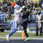 
              Seattle Seahawks wide receiver DK Metcalf, right, makes a catch for a touchdown in front of Detroit Lions cornerback Ifeatu Melifonwu, left, during the second half of an NFL football game, Sunday, Jan. 2, 2022, in Seattle. (AP Photo/John Froschauer)
            