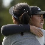 
              Danielle Kang of the U.S., right, hugs Lydia Ko of New Zealand, after they finished play in the third round of the Gainbridge LPGA golf tournament, Saturday, Jan. 29, 2022, in Boca Raton, Fla. (AP Photo/Rebecca Blackwell)
            