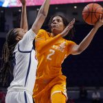 
              Tennessee forward Alexus Dye (2) attempts a hook shot in front of a Mississippi defender during the first half of an NCAA college basketball game in Oxford, Miss., Sunday, Jan. 9, 2022. (AP Photo/Rogelio V. Solis)
            