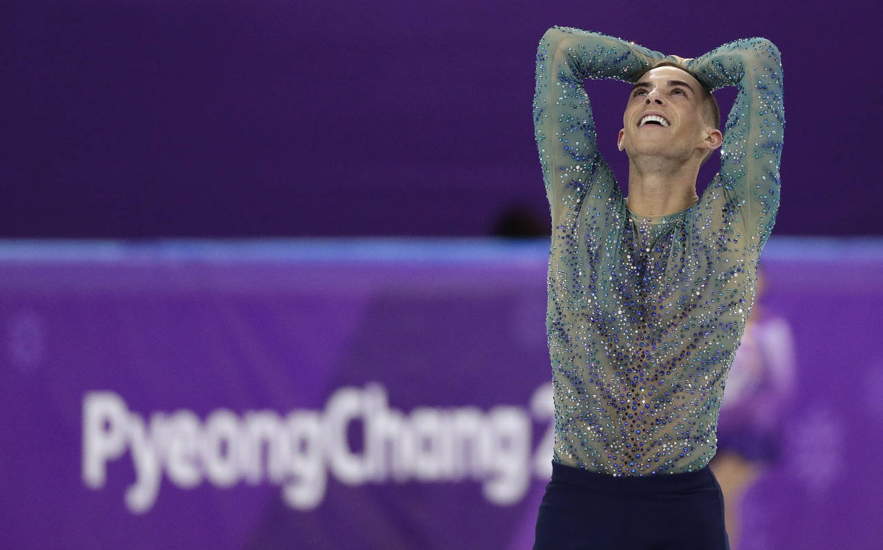 FILE - Adam Rippon of the United States reacts following his performance in the men's free figure s...