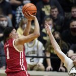 
              Wisconsin's Johnny Davis (1) shoots over Purdue's Sasha Stefanovic (55) during the second half of an NCAA basketball game, Monday, Jan. 3, 2022, in West Lafayette, Ind. (AP Photo/Darron Cummings)
            