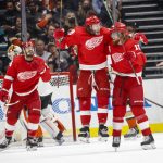 
              Detroit Red Wings forward Tyler Bertuzzi, center, celebrates his goal with defenseman Marc Staal, right during the second period of an NHL hockey game against the Anaheim Ducks, Sunday, Jan. 9, 2022, in Anaheim, Calif. (AP Photo/Ringo H.W. Chiu)
            