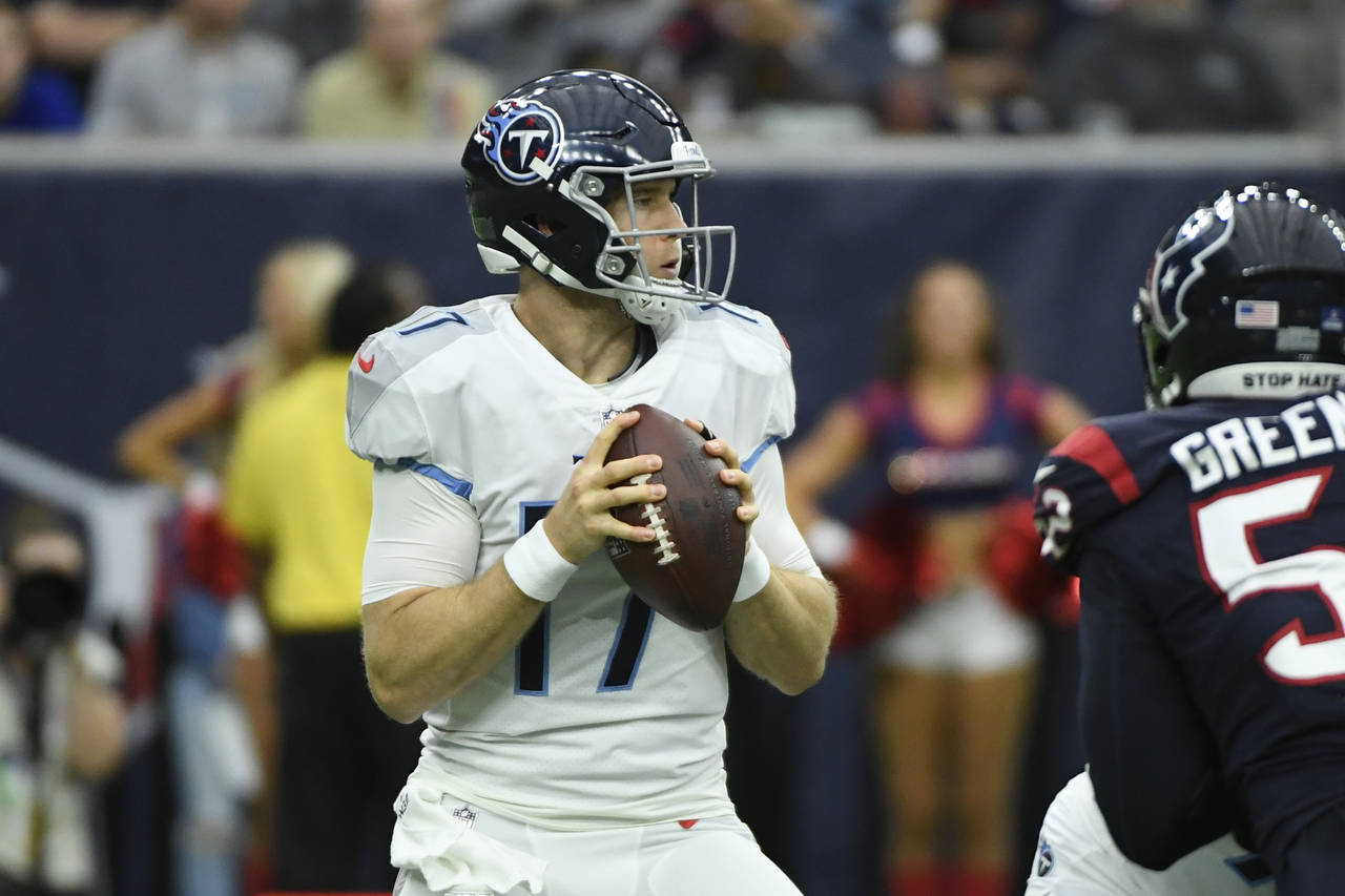 Tennessee Titans quarterback Ryan Tannehill (17) looks to throw against the Houston Texans during t...