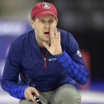 
              Team Shuster's John Shuster yells to his teammates after throwing the rock while competing against Team Dropkin at the U.S. Olympic Curling Team Trials at Baxter Arena in Omaha, Neb., Wednesday, Nov. 17, 2021. The John Shuster-skipped team that upset Sweden at the 2018 Winter Games will be in Beijing next month to play for another gold. (AP Photo/Rebecca S. Gratz)
            