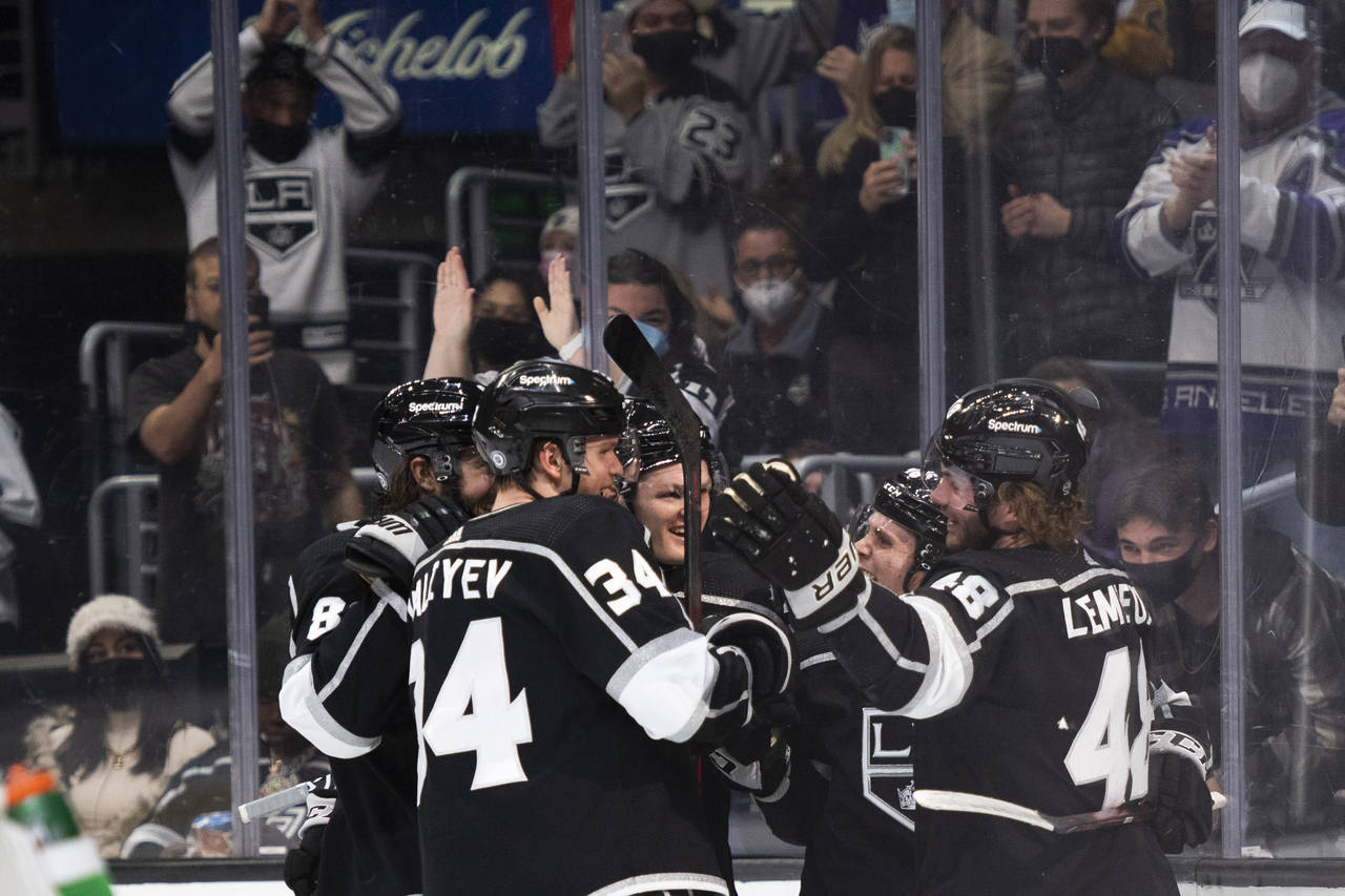 Los Angeles Kings celebrate a goal by left wing Brendan Lemieux, right, during the second period of...
