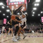
              Stanford guard Jordan Hamilton, right, passes the ball while being defended by Arizona State guard Sydney Erikstrup during the second half of an NCAA college basketball game in Stanford, Calif., Friday, Jan. 28, 2022. (AP Photo/Jeff Chiu)
            