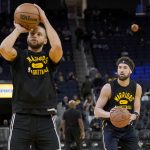 
              Golden State Warriors guard Stephen Curry, left, and guard Klay Thompson warm up before an NBA basketball game against the Miami Heat in San Francisco, Monday, Jan. 3, 2022. (AP Photo/Jeff Chiu)
            