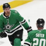 
              Dallas Stars center Joe Pavelski (16) celebrates scoring a goal in front of teammate Ryan Suter (20) during the third period of an NHL hockey game against the Pittsburgh Penguins in Dallas, Saturday, Jan. 8, 2022. The Stars won 3-2. (AP Photo/LM Otero)
            