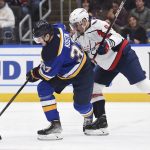 
              Washington Capitals defenseman Dmitry Orlov (9) defends against St. Louis Blues center Klim Kostin (37) during the second period of an NHL hockey game Friday, Jan. 7, 2022, in St. Louis. (AP Photo/Joe Puetz)
            