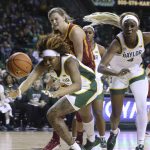 
              Baylor forward NaLyssa Smith, left, chases after a loose ball with teammate Queen Egbo, right, and Iowa State guard Ashley Joens, center, in the first half of an NCAA college basketball game, Sunday, Jan. 23, 2022, in Waco, Texas. (Rod Aydelotte/Waco Tribune-Herald via AP)
            