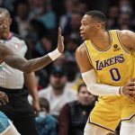 
              Charlotte Hornets guard Terry Rozier (3) guards against Los Angeles Lakers guard Russell Westbrook (0) during the first half of an NBA basketball game in Charlotte, N.C., Friday, Jan. 28, 2022. (AP Photo/Jacob Kupferman)
            