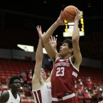 
              Stanford forward Brandon Angel, right, shoots over Washington State forward Andrej Jakimovski during the first half of an NCAA college basketball game, Thursday, Jan. 13, 2022, in Pullman, Wash. (AP Photo/Young Kwak)
            