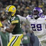 
              Green Bay Packers' Davante Adams catches a pass with Minnesota Vikings' Kris Boyd defending during the first half of an NFL football game Sunday, Jan. 2, 2022, in Green Bay, Wis. (AP Photo/Aaron Gash)
            