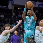 
              Charlotte Hornets guard Terry Rozier (3) drives to the basket between Oklahoma City Thunder guards Ty Jerome, left, and Tre Mann (23) during the first half of an NBA basketball game Friday, Jan. 21, 2022, in Charlotte, N.C. (AP Photo/Rusty Jones)
            