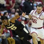
              Purdue's Jaden Ivey (23) and Indiana's Parker Stewart (45) battle for the ball during the second half of an NCAA college basketball game, Thursday, Jan. 20, 2022, in Bloomington, Ind. (AP Photo/Darron Cummings)
            