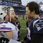 
              FILE - Buffalo Bills defensive tackle Kyle Williams, left, and New England Patriots quarterback Tom Brady, right, speak at midfield after an NFL football game, Sunday, Dec. 24, 2017, in Foxborough, Mass. The Patriots beat the Bills 37-16. (AP Photo/Steven Senne, File)
            
