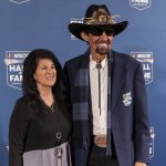 
              NASCAR Hall of Fame member Richard Petty, right, stops to pose for photos before the induction ceremony on Friday, Jan. 21, 2022, in Charlotte, N.C. (AP Photo/Matt Kelley)
            