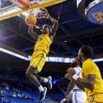 
              Long Beach State guard Aboubacar Traore (25) dunks against UCLA during the second half of an NCAA college basketball game Thursday, Jan. 6, 2022, in Los Angeles. UCLA won 96-78. (AP Photo/Ringo H.W. Chiu)
            