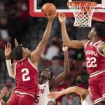 
              Indiana's Michael Durr (2) and Jordan Geronimo (22) reach for a rebound against Nebraska's Bryce McGowens, left, and Eduardo Andre (35) during the first half of an NCAA college basketball game Monday, Jan. 17, 2022, in Lincoln, Neb. (AP Photo/Rebecca S. Gratz)
            