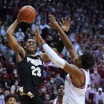 
              Purdue's Jaden Ivey (23) goes to the basket against Indiana's Michael Durr (2) during the first half of an NCAA college basketball game Thursday, Jan. 20, 2022, in Bloomington, Ind. (Darron Cummings)
            