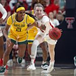 
              Baylor's Ja'Mee Asberry (21) steals the ball from Texas Tech's Rhyle McKinney (5) during the first half of an NCAA college basketball game on Wednesday, Jan. 26, 2022, in Lubbock, Texas. (AP Photo/Brad Tollefson)
            