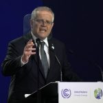 
              FILE - Australian Prime Minister Scott Morrison gestures as he makes a statement at the COP26 U.N. Climate Summit in Glasgow, Scotland, Nov. 1, 2021. Weary after two years of some of the harshest COVID-19 border restrictions in the world, many Australians wanted tennis star Novak Djokovic kicked out of their country for traveling to a tennis tournament without being vaccinated. But the backdrop to the government's tough line on the defending Australian Open champion and Morrison’s description of the expulsion as a "decision to keep our borders strong" dates to nearly a decade ago. It also shines a light on Australia's complicated, and strongly criticized, immigration and border policies. (AP Photo/Alastair Grant, Pool, File)
            