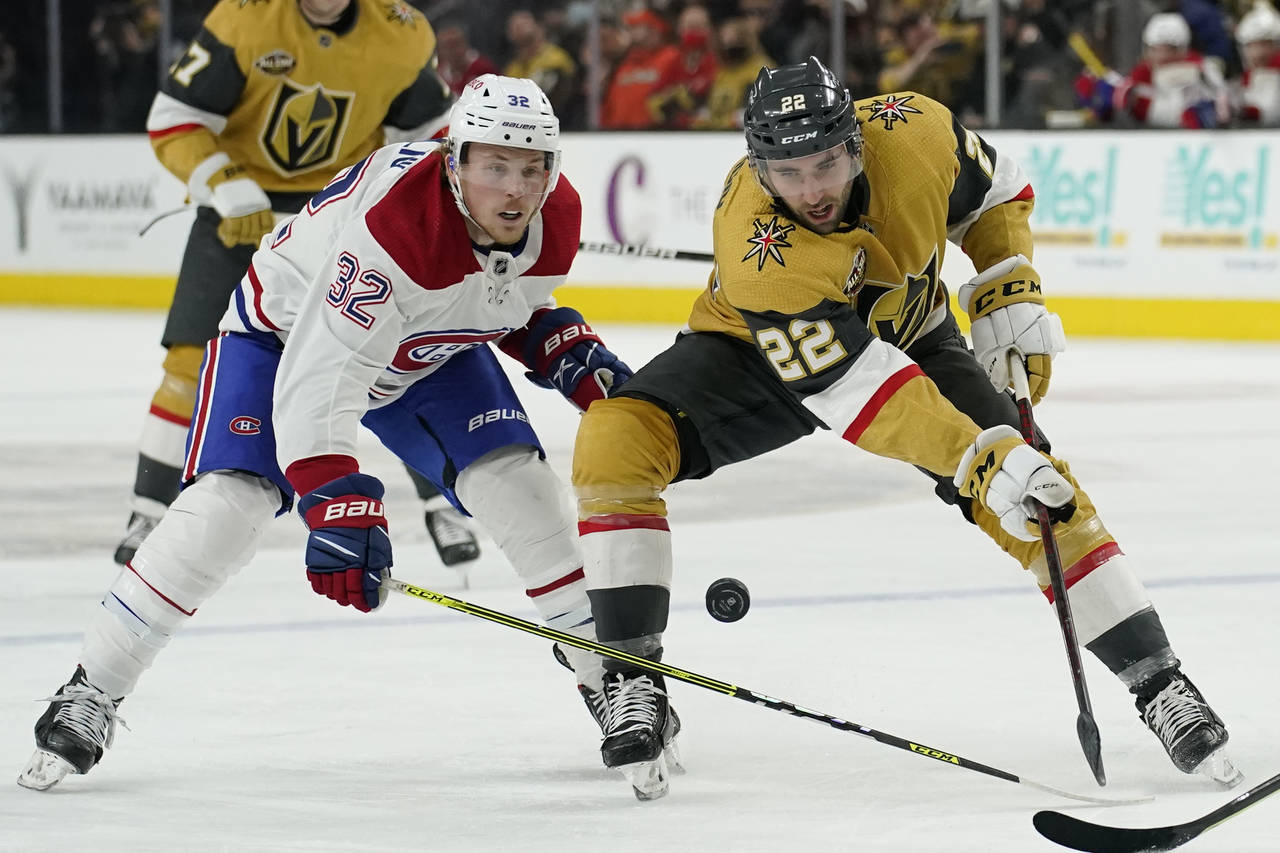 Montreal Canadiens center Rem Pitlick (32) battles for the puck with Vegas Golden Knights center Mi...