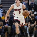 
              Miami Heat guard Kyle Guy (5) dribbles the ball up the court against the Golden State Warriors during the first half of an NBA basketball game in San Francisco, Monday, Jan. 3, 2022. (AP Photo/Jeff Chiu)
            