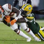
              Green Bay Packers' De'Vondre Campbell stops Cleveland Browns D'Ernest Johnson during the second half of an NFL football game Saturday, Dec. 25, 2021, in Green Bay, Wis. (AP Photo/Matt Ludtke)
            