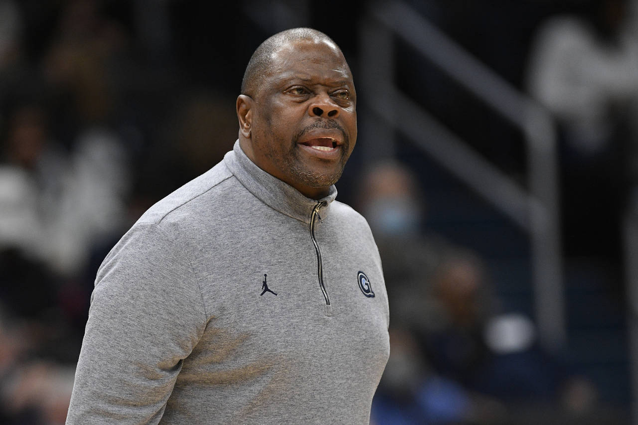 FILE - Georgetown head coach Patrick Ewing reacts during the first half of an NCAA college basketba...