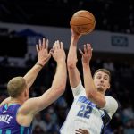 
              Orlando Magic forward Franz Wagner (22) passes over Charlotte Hornets center Mason Plumlee (24) during the first half of an NBA basketball game on Friday, Jan. 14, 2022, in Charlotte, N.C. (AP Photo/Rusty Jones)
            