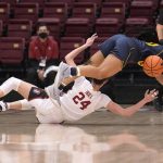 
              California guard Jayda Curry (30) dives for the ball over Stanford guard Lacie Hull (24) during the first half of an NCAA college basketball game in Stanford, Calif., Friday, Jan. 21, 2022. (AP Photo/Tony Avelar)
            