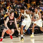 
              Davidson guard Foster Loyer (0) looks to make pass as Virginia Commonwealth forward Hason Ward (20) and guard KeShawn Curry (11) defend during the second half  of an NCAA basketball game on Tuesday, Jan. 18, 2022, in Richmond, Va. (Shaban Athuman/Richmond Times-Dispatch via AP)
            
