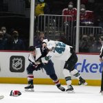 
              San Jose Sharks left wing Jonah Gadjovich (42) and Washington Capitals right wing Garnet Hathaway (21) fight after an NHL hockey game, Wednesday, Jan. 26, 2022, in Washington. The Sharks defeated the Capitals 4-1. (AP Photo/Evan Vucci)
            