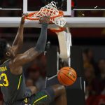 
              Baylor forward Jonathan Tchamwa Tchatchoua (23) dunks against Iowa State during the first half of an NCAA college basketball game, Saturday, Jan. 1, 2022, in Ames. (AP Photo/Matthew Putney)
            